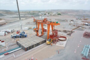 At Venetia Mine, the pre-sink gantry arrangement included a blast cover and kibble tipping system, designed to protect workers and equipment during early shaft sinking.