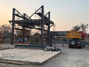 Structural steel components of the ore loading bin prepared for assembly on site.