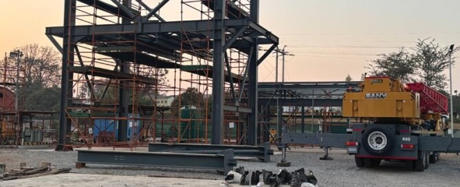Structural steel components of the ore loading bin prepared for assembly on site.